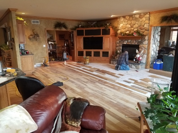 An Authentic Hardwood Installation in Progress A Living Room Hardwood Installation in Wisconsin by our Flooring Contractors