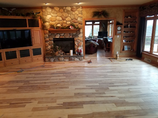 An Authentic Hardwood Living Room Floor Completed by our Flooring Contractors
