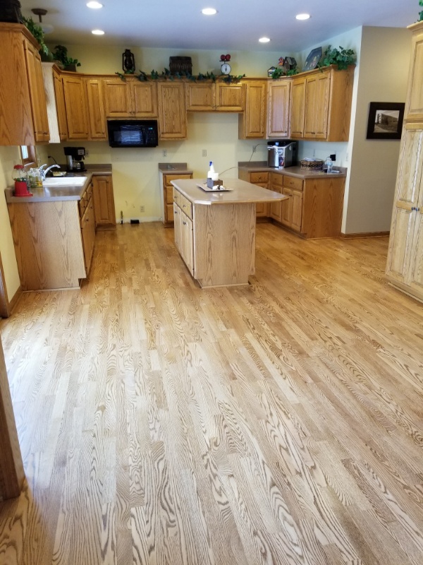 A completed custom cut hardwood kitchen floor