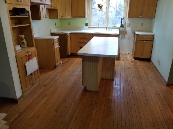 A kitchen before the Custom hardwood Contractors at Art Wood began