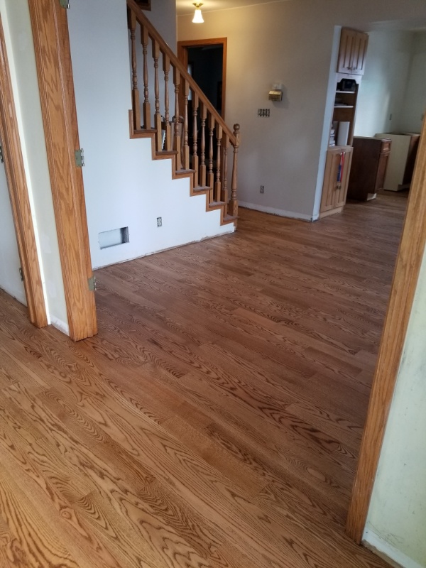 A completed artisinal wood floor in Wisconsin Hardwood Living Room Floor installed by Art Wood Flooring Contractors