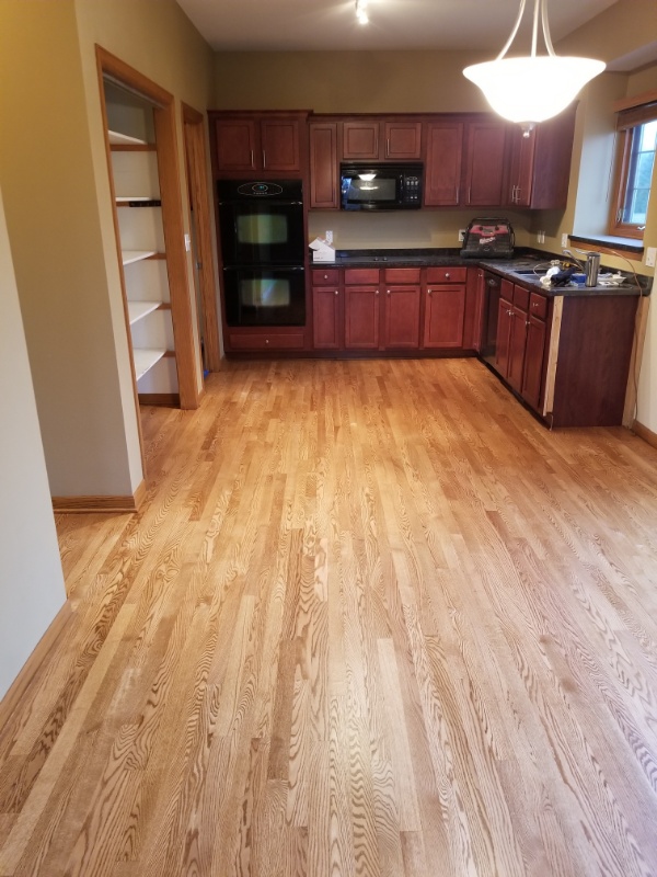Light Kitchen Flooring Installation in Wisconsin Custom Kitchen hardwood flooring by Wisconsin's Wood Floor Contractors