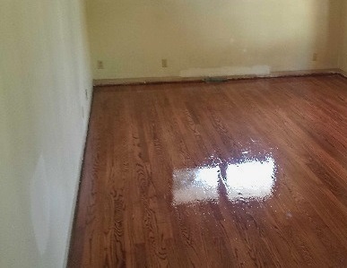 Bedroom with Stained Hardwood Flooring